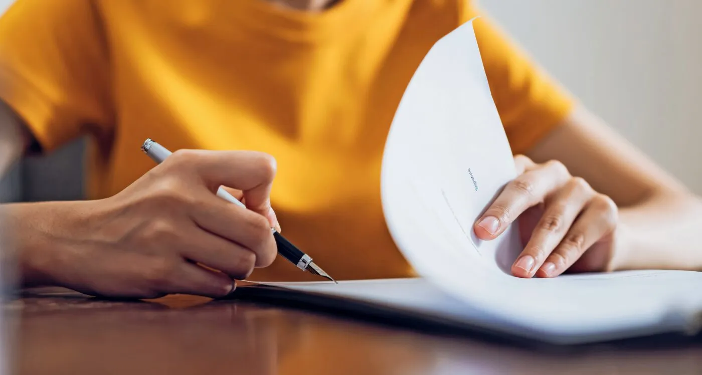 Woman Signing Document And Hand Holding Pen Putting Signature At Paper, Order To Authorize Their Rights.