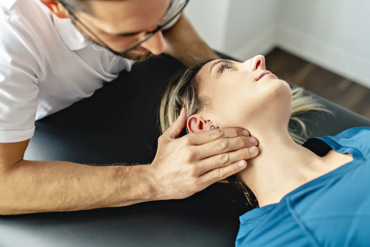 A Modern Rehabilitation Physiotherapy Man At Work With Woman Client Woking On Neck