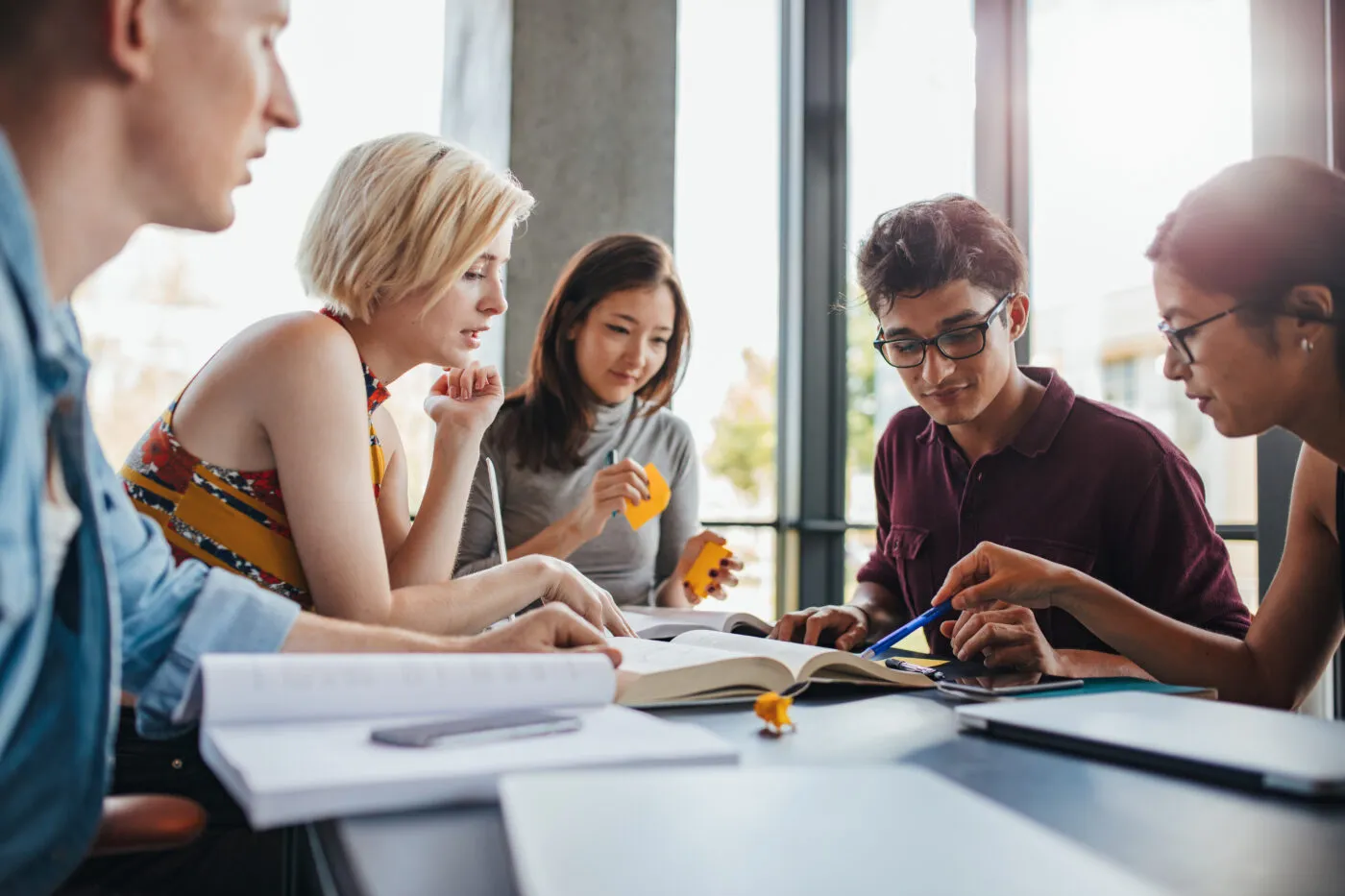 Diverse Group Of Students Studying At Library